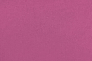 Purple homogeneous background with a textured surface, fabric.