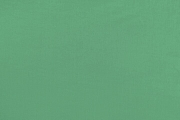 Green homogeneous background with a textured surface, fabric.