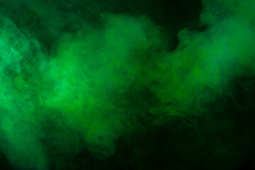 Fototapeta na wymiar Green smoke texture on black background
