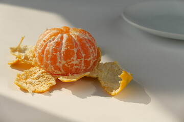 peeled tangerine on a plate