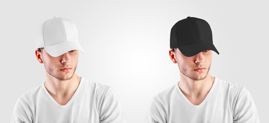 A mockup of a white, black cap on a guy, looking out from under the visor, front view, for the presentation of the design.