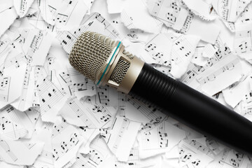 Microphone on the background of notes.