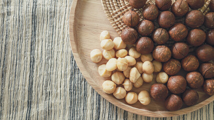 Organic Macadamia nut. macadamia nuts are cracked and baked to taste extremely delicious superfood fresh natural shelled unsalted raw macadamia and healthy food concept