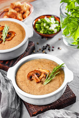  Mushroom cream soup on the table, vertical photo