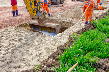 Group of workers with safety gear at construction site