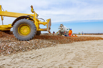 Grader is leveling fraction over construction site