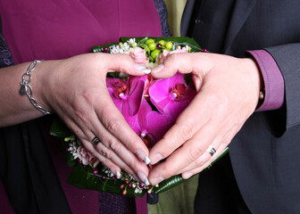 bride and groom holding hands