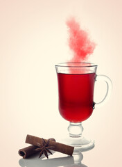 Glass with mulled wine and spices