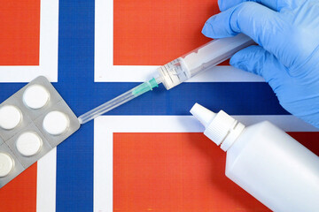 pills and syringe on Norway flag, coronavirus epidemic in Norway concept, covid - 19, coronavirus...
