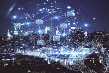 Double exposure of envelop hologram flying from gadget and city view background. Concept e-mail.