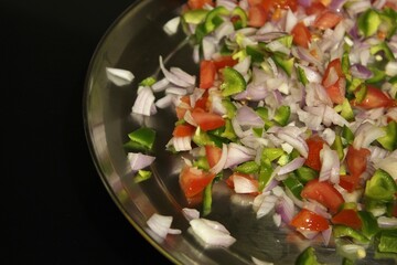 Diced vegetables including tomatoes, onion and capsicum 