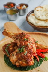 Tandoori Chicken. Indian barbecue chicken. Indian chicken dish prepared by roasting chicken marinated in yogurt and spices