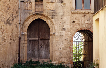 Fototapeta na wymiar Italy. The old houses of the fishermen village Cefalu of Sicilia.