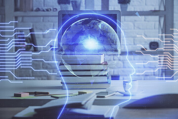 Double exposure of work space with computer and human brain drawing hologram. Brainstorm concept.