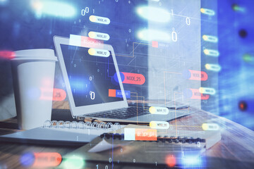 Double exposure of desktop computer and technology theme hologram. Concept of software development.