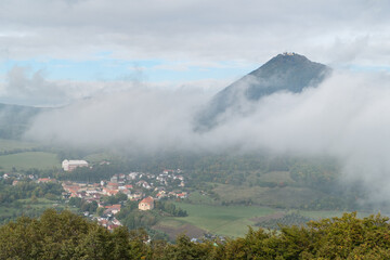 milesovka mountain seen from ostry above morning fog - obrazy, fototapety, plakaty