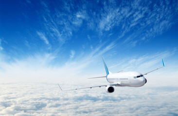 Fototapeta premium Landscape with airplane is flying in the blue sky and white clouds.