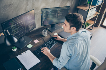 Top above high angle view portrait of his he nice attractive focused skilled geek guy typing bug...