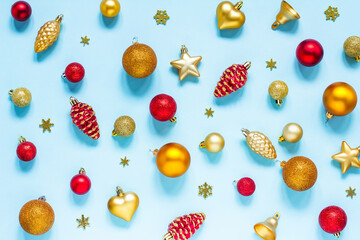Fototapeta na wymiar Background with Christmas toys, red and gold on a blue background. Balloons, stars, bells, snowflakes and cones. New year, Christmas