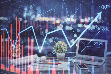 Stock market graph and table with computer background. Multi exposure. Concept of financial...