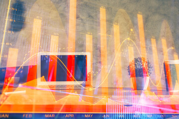 Double exposure of forex graph and work space with computer. Concept of international online trading.