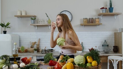 Girl recommending eating raw vegetable food. Showing cauliflower in hands. Weight loss, diet concept