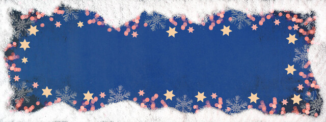 Christmas / winter / advent festive celebration background banner panorama template - Frame made of snow with snowflakes bokeh lights, stars and ice crystals on dark blue colored texture, top view