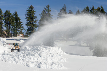 Now that's a snow blower! With 10-15 feet of snow a year, snow blowing is a full time activity to keep the roads clear for visitors at Crater Lake National Park. Oregon.