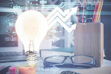 Bulb drawing with glasses on the table background. Idea concept. Double exposure.