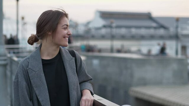 Young woman look at the camera and smiles