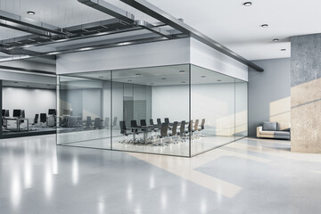 Modern meeting loft room with equipment and glass wall.