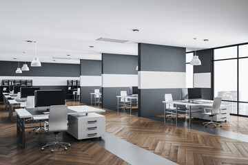 Modern office interior with rows of computer tables