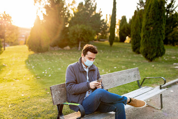 boy waiting on a bench