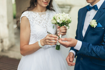 bride and groom with bouquet