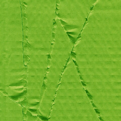 A green vintage rough sheet of carton. Recycled environmentally friendly cardboard paper texture. Simple and bright minimalist papercraft background.