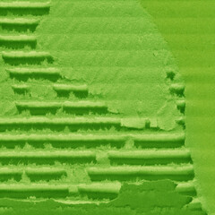 A green vintage rough sheet of carton. Recycled environmentally friendly cardboard paper texture. Simple and bright minimalist papercraft background.
