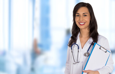 Portrait of attractive young female doctor. Hospital theme.