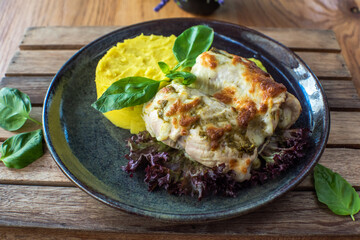 Chicken with Mashed Potatoes and Gravy on wooden background
