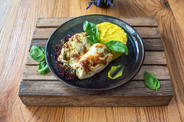 Chicken with Mashed Potatoes and Gravy on wooden background