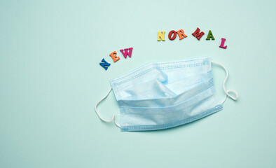 disposable medical face mask and lettering new normal