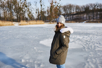 Fototapeta na wymiar A portrait of beautiful caucasian girl in glases outdoor in snowy winter.