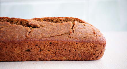 Homemade whole grain einkorn bread on a white surface. Close up picture