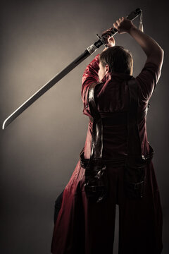 male warrior in cloak with sword
