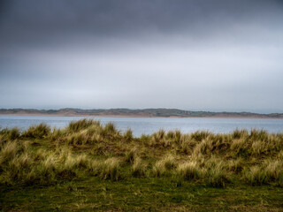 Fototapeta na wymiar Marram grass view as storm comes in over Northam Burrows, North Devon, UK.