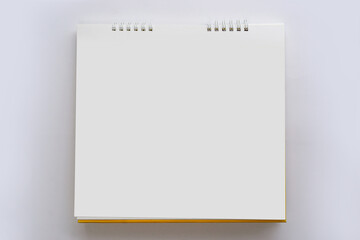 Calendar paper blank top view on a grey background. 