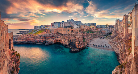 Spectacular spring cityscape of Polignano a Mare town, Puglia region, Italy, Europe. Incredible evening seascape of Adriatic sea. Traveling concept  background. - obrazy, fototapety, plakaty