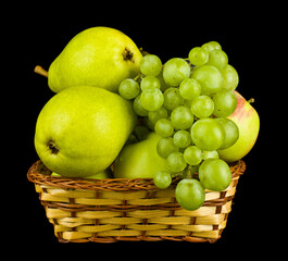 Fruit apples, pears and grapes isolated on a black background close-up.