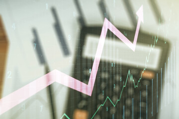 Multi exposure of virtual abstract financial chart and upward arrow interface on blurry calculator...