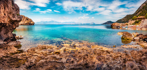Panoramic summer view of empty beach on northeastern Corinthia, Greece, Europe. Bright outdoor...