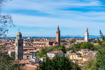 Obraz premium Beautiful view of Giusti gardens and look out over Italian city Verona. Trees and flowers in front of Verona skyline and houses. No people